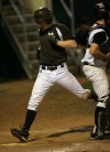 Mount Camel's Chris Sujka scores in the third inning