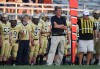 Football coaching record book remains up in the air