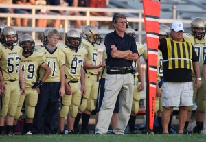 Football coaching record book remains up in the air
