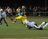 Mount Carmel defensive back Vincent Speller, ground, brings down
