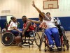 Wheelchair basketball players exhibit their skill for youngsters