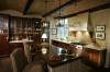 Warmth and worldly flair define a vast riverside estate