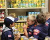 Scouts donate food and stock the shelves