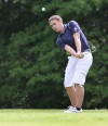 Bishop Noll's John Mitchell chips toward the green on No. 9 Friday at Forest Park during the Valparaiso Sectional.