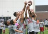 Pierre Thomas campers battle for possession of a thrown pass