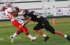 Morton's Josh Gordon is tackled by Lowell's Alex Torres