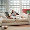 Super-sized sofas are fast becoming fixtures in homes, spreading bedroom coziness throughout the house