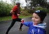 Megan Bucko offers water to runners