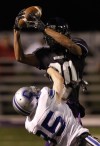 Merrillville's Ryan Neal intercepts against Carroll