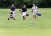 Bishop Noll's John Mitchell, left, Hobart's Alex Metz, middle, and Wheeler's Drew Heinold walk toward the green