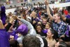 Fans and players rush the floor