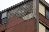 Storm rips brick facade off E.C. high-rise apartment complex