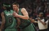Boston Celtics' rookie forward Luke Harangody talks to teammate Marquis Daniels