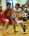 Morgan Township's Jaron Coleman drives past South Central's Rick Rigsby