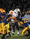 Mount Carmel running back Matt Domer takes on two Lyons Township