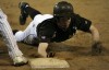 Mount Carmel's Beau Filkins returns safely to first base