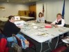 Volunteers clip, sort coupons for troops