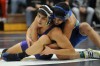 Hobart's Tom Camacho, left, attempts to escape the grasp