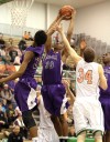 Merrillville's Jamard Owens pulls down a rebound at Valparaiso's basket in the first half Friday.