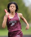 Bowman Academy's Jalaya Bryant runs her leg