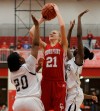 Crown Point's Michaela Prough shoots over Michigan City's Jameka Collins