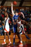 Lake Central's Lindsay Kusbel and West Side's Jerrica Neal and Lessia Smith go up for a rebound Wednesday.