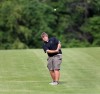 Chesterton's Brandon Martin chips toward the green on No. 2 Friday at Forest Park during the Valparaiso Sectional.