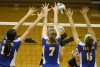 Carmel players block a hit by Lake Central's Tori Gardenhire on Saturday.