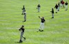 Baseball players warm up playing catch