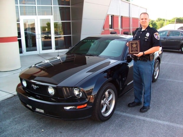 Pickford's police vehicle is a 2006 black Ford Mustang