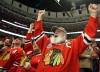 Blackhawks fans celebrate a goal by Michael Frolik
