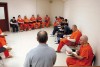 County officials revamp jail booking fee  