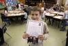 Lansing teacher offers lesson in giving