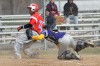 T.F. North catcher Joe Mendoza dives