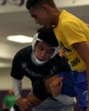 Adam Garcia practices with Merrillville teammate Clarence Johnson