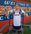 Austin Olive holding 2 hurdles