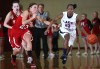 Munster's Bernadette Grabowski tries to stop E.C. Central's Denitra Brown