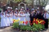 Communicants crown Blessed Mother statues