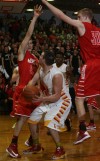 Munster's Luke Wuchenich and Nate Bubash double-team Andrean's Sam Toporski under the basket