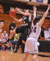 Purdue Calumet's Brooklyn Short drives around Olivet Nazarene's Rachel Kearney on Wednesday night.