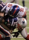 Justin Tuck, Tom Brady