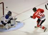 Blackhawks rally, beat Blues in shootout
