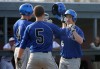 Lake Central's Chuck Alexa is greeted at home plate by teammates Steve Fulk, left, and Brenden Seren following a home run against Portage on Friday.