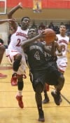 Bowman's Derrick Thompson draws a foul from E.C. Central's Martayveus Carter on Tuesday.