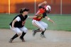 LaPorte shortstop Emma Dickson holds out the ball to tag