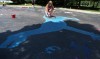 Kids paint the Crete Library parking lot