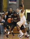 Erik Buggs, right, defends St. Joseph's Maiscei Grier