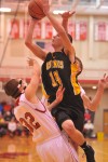 Kouts' Cody Nelson collides with Hebron's Jon Moneta during the frst quarter