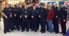 Police and firefighters shop with kids