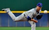 Wells, bullpen combine to blank Braves